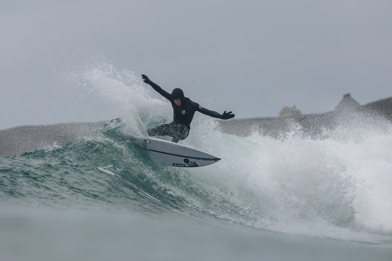 Lukas Skinner carving on his surfboard