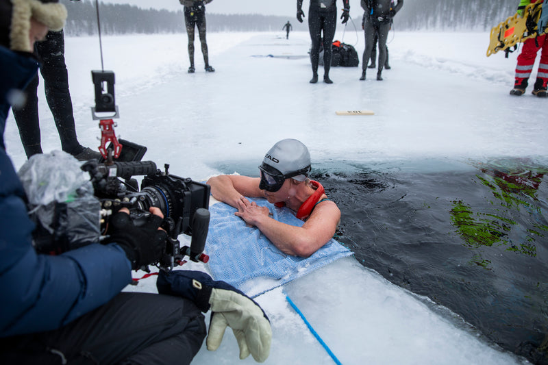 Johanna coming out of the ice hole and taking breaths after completing her world record