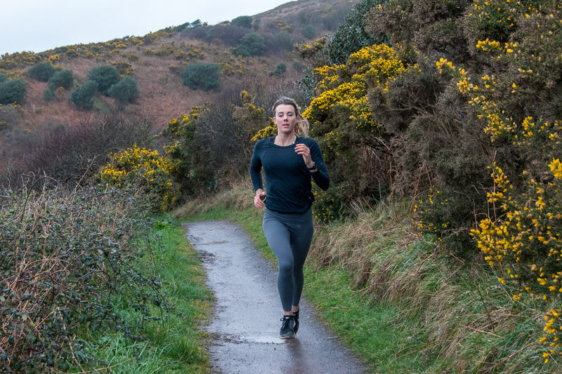 A woman running in the countryside