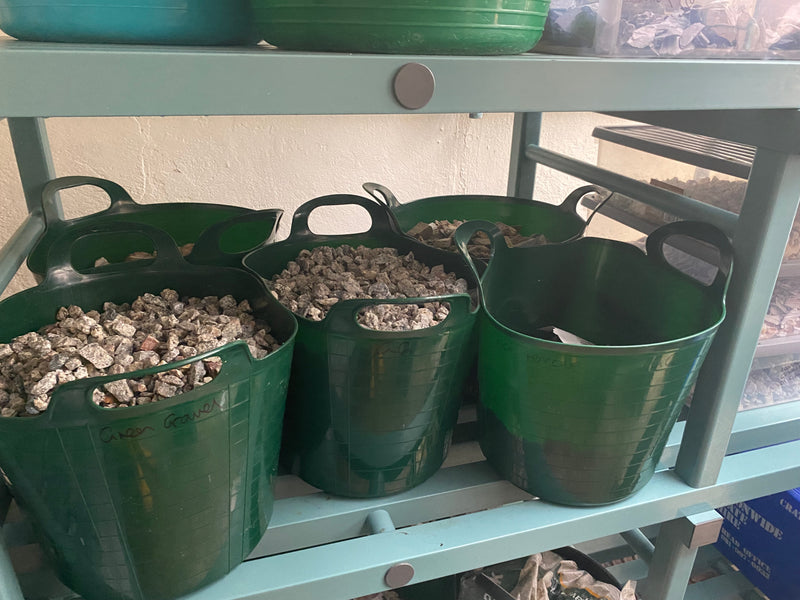 Rocks in green buckets