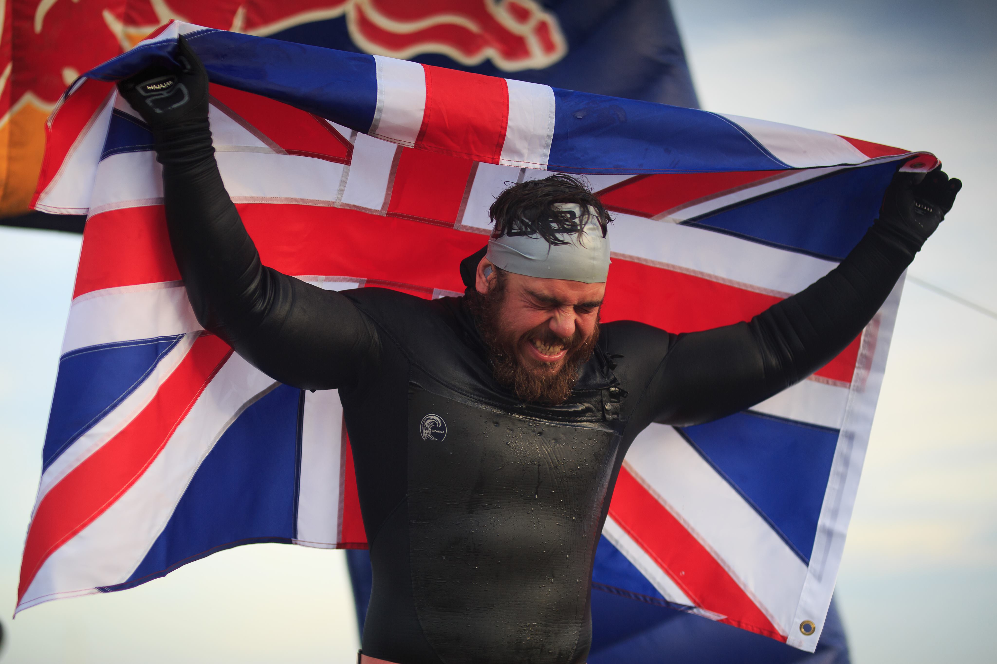 Ross Edgley holding Union Jack. Photo by James Appleton