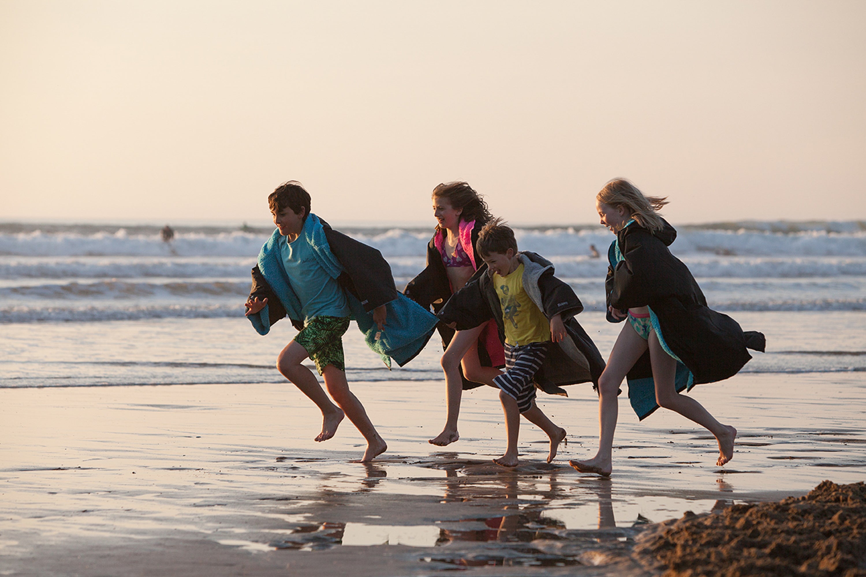 Children running on the beach