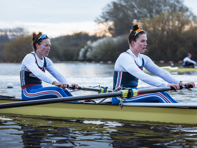 Two female rowers rowing 
