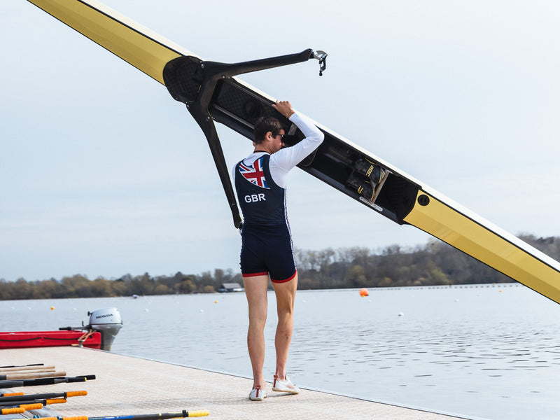 A rower holding a boat 