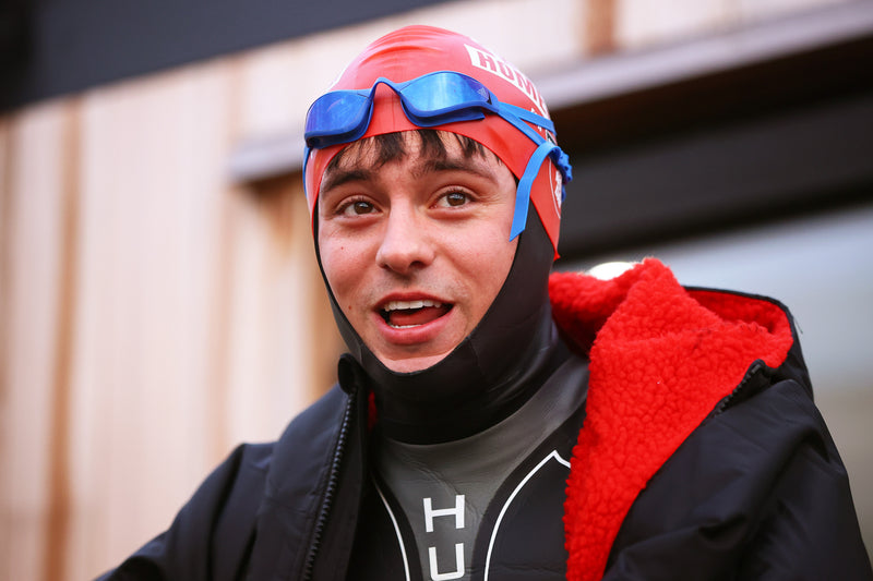 Tom Daley in his wetsuit, swim cap, googles and dryrobe Advance