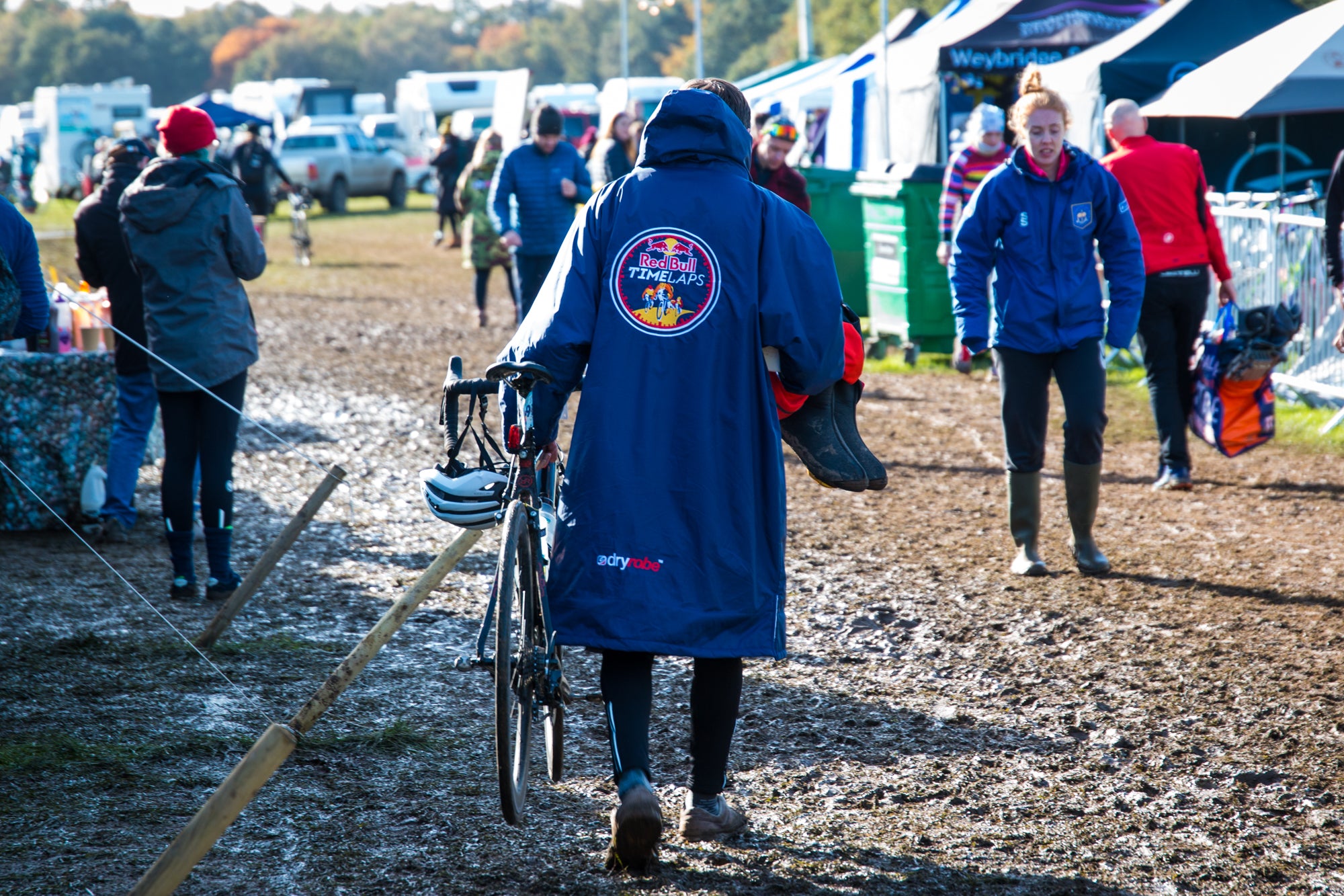 Rider pushing bike through mud at Red Bull Timelaps 2019