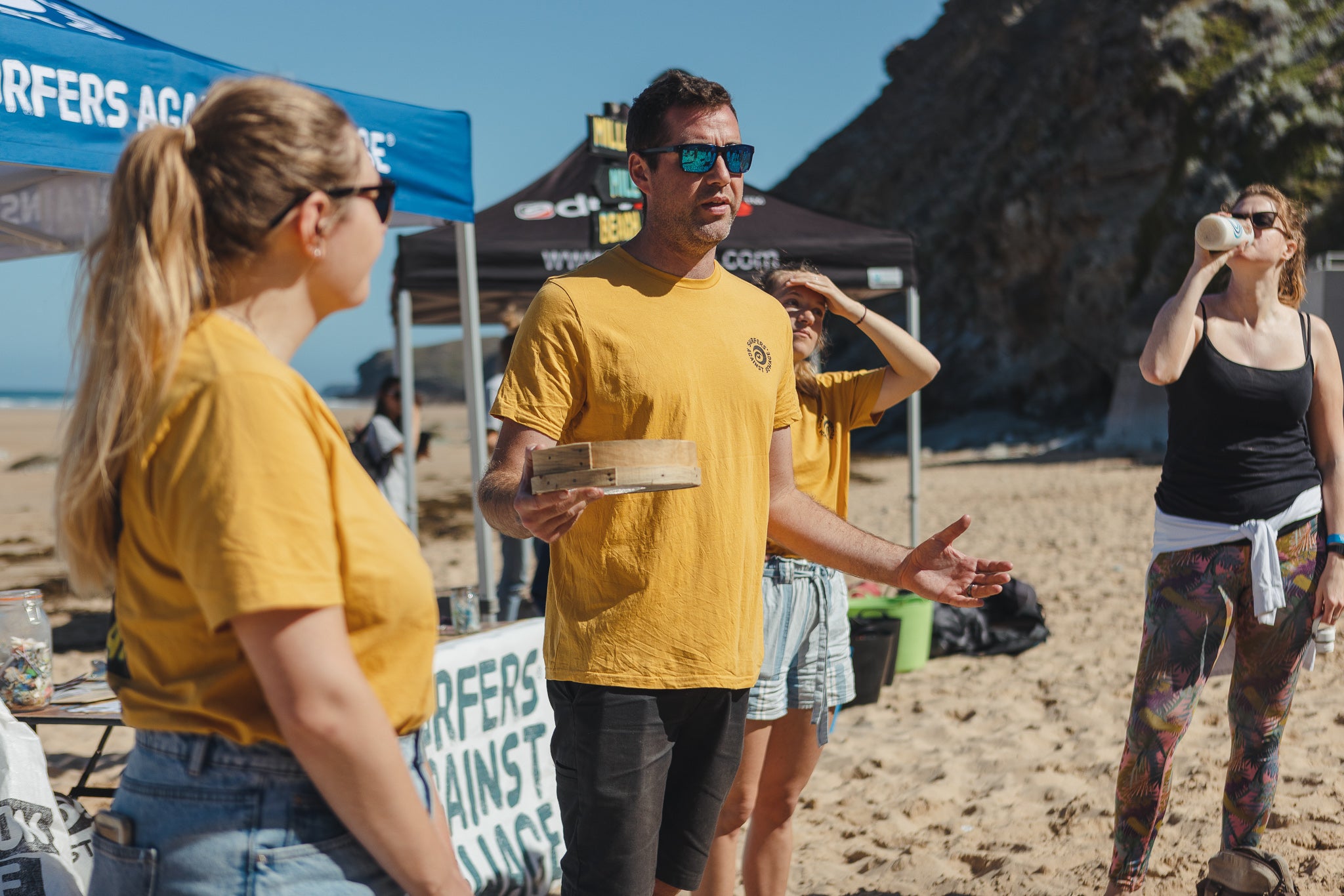 Surfers Against Sewage Community & Events Manager Jack Middleton talking to beach cleaners 