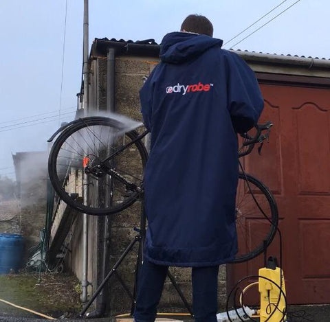 Mountain biking cleaning in a dryrobe