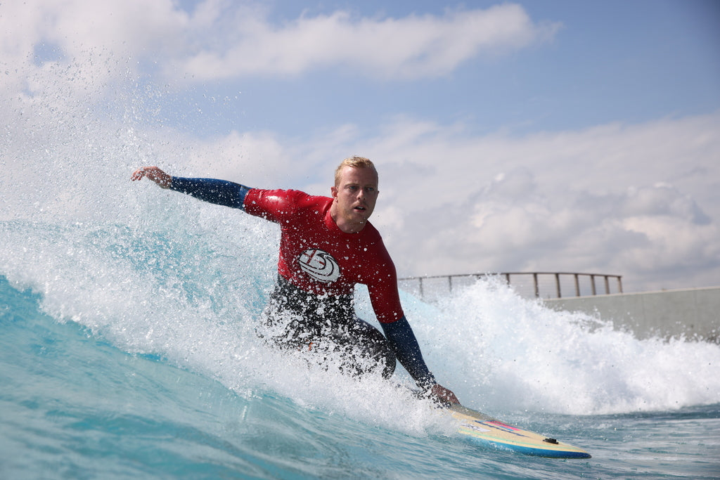 Adaptive surfer competing at the 2021 dryrobe English Adaptive Surfing Open