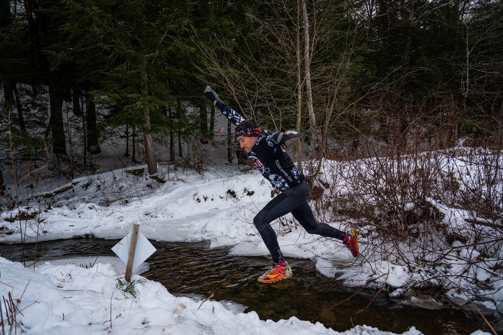 Evan Perperis - Jumping over a stream during OCR America 2