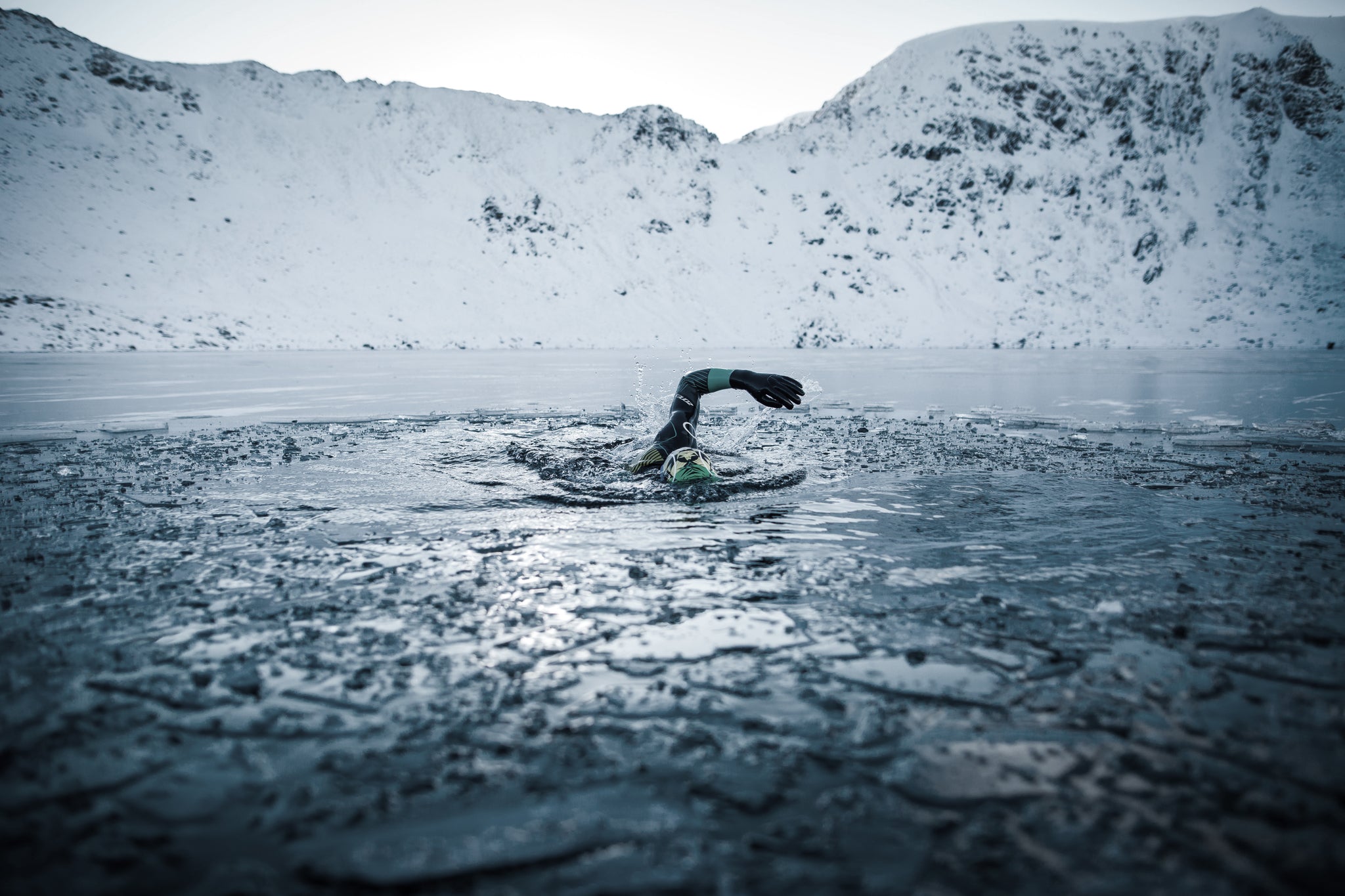 Jacob Tonkin swimming through the ice at at Red Tarn