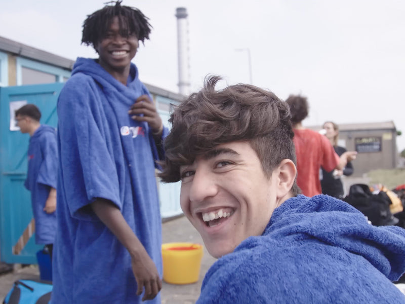 Two Wave Project participants smiling in Towel dryrobes