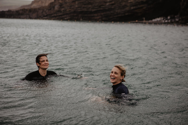 Two women open water swimming