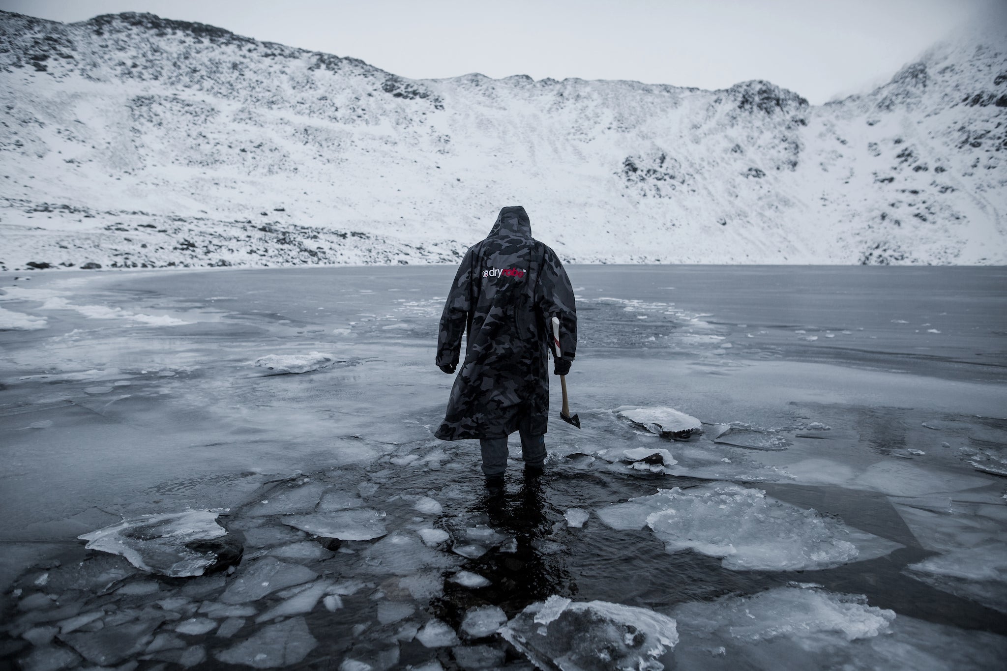 Jacob Tonkin in his dryrobe walking through ice