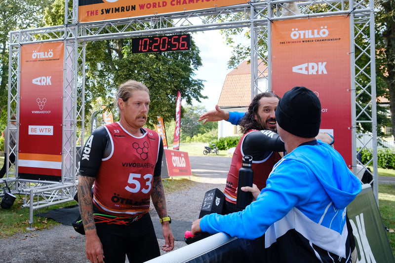 The Low Tide Boyz coming through the finish line at the 2022 ÖTILLÖ Swimrun World Championships 