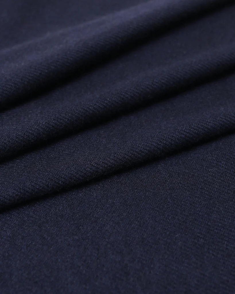 Close-up of a cashmere fabric in dark blue.