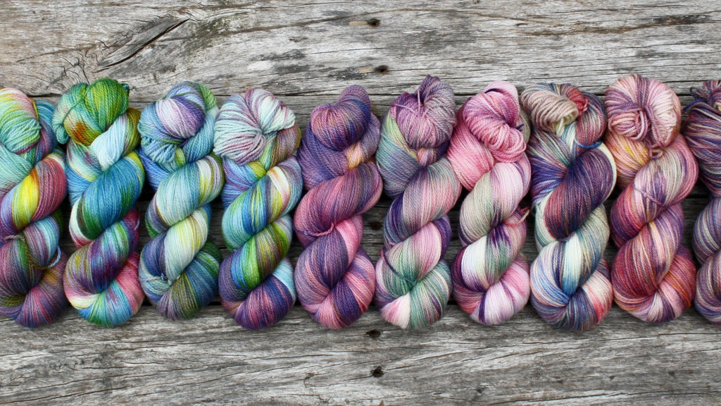 Augustbird Hand Dyed Yarn Australia. A row of variegated hand-dyed yarn.