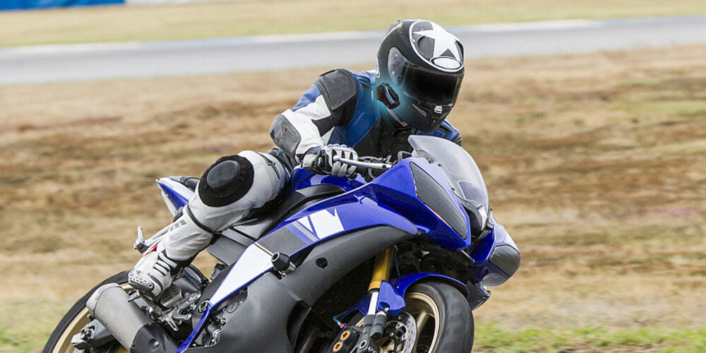 Moman compact intercom system for communication during high-speed motorbike races. They provide stable and clean audio for real-time speaking.