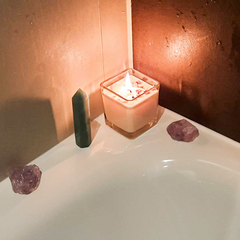 Candle and crystals on the bath side