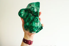 Malachite slab in hand