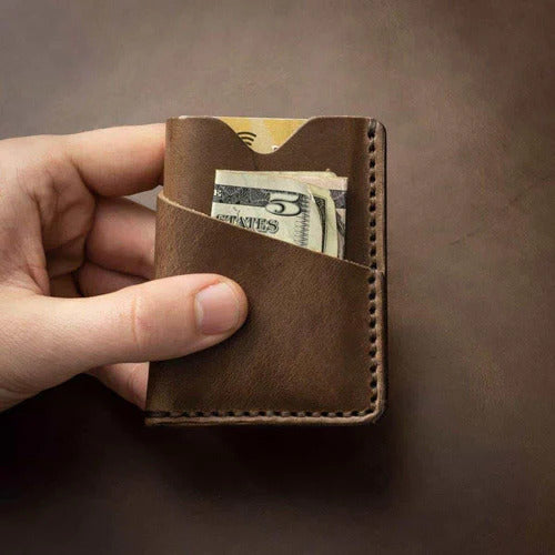 Handmade leather card wallet with a bar style money clip inside.