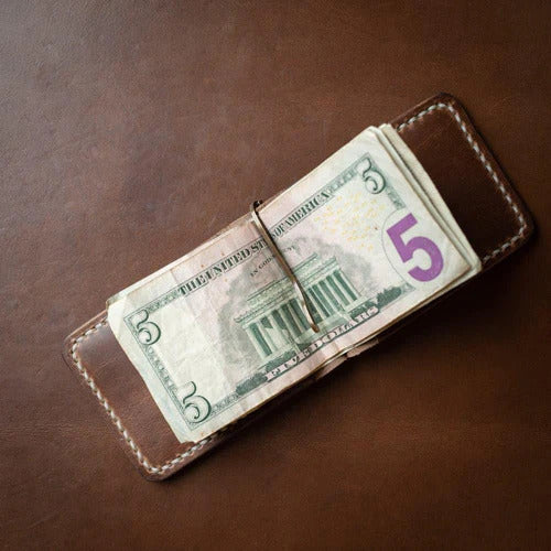 Handmade leather card wallet with a bar style money clip inside.