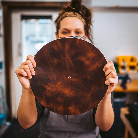 Holding a leather turntable mat