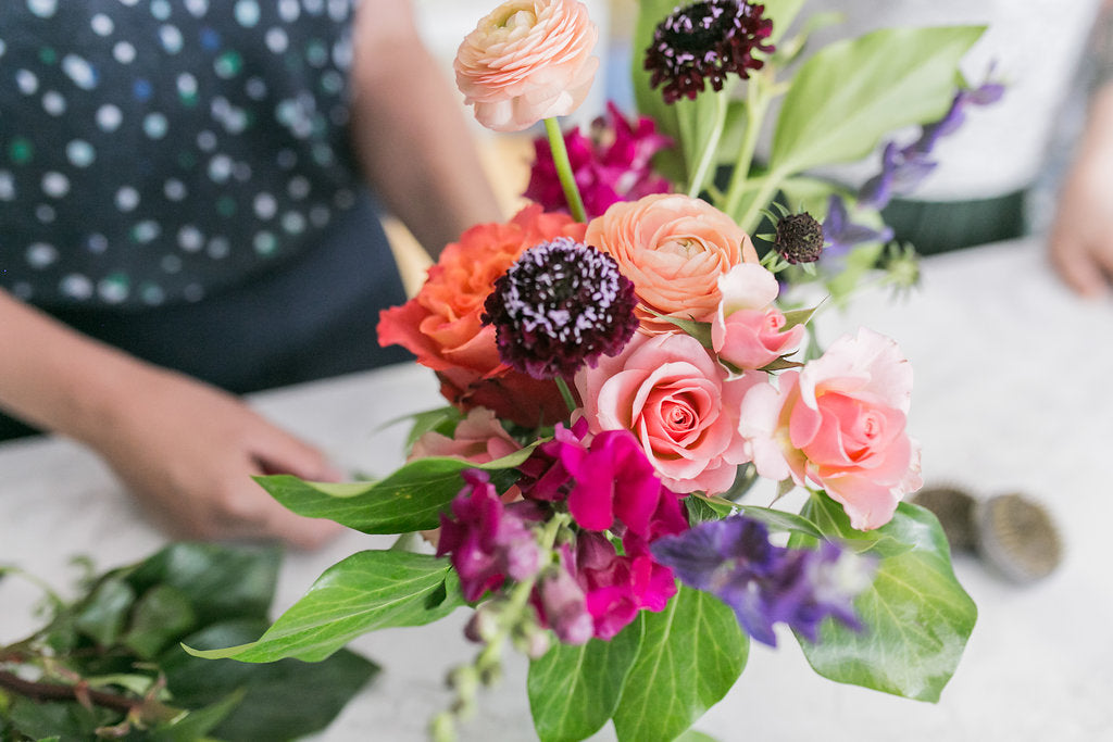 Toronto florist Periwinkle Flowers arranges a bouquet for delivery