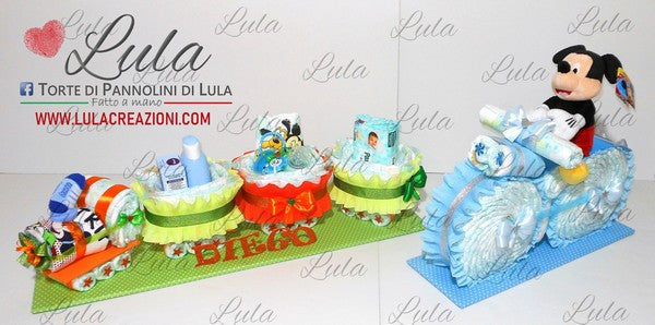 torte di pannolini pampers lula creazioni belle idea regalo nascita battesimo baby shower maschio femmina particolare utile spedizioni italia milano roma napoli treno trenino colorato allegro con regalini: prodotti igiene e bagno, bavaglino, calzini topolino. moto con peluche