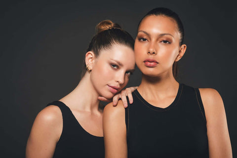 Two models in organic black clothing.