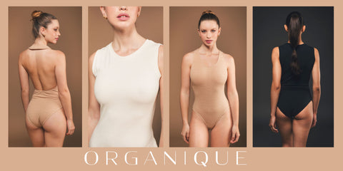 Image of collection of organic bodysuits made by Organique, a sustainable clothing brand.