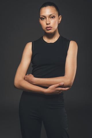 Image of black jumpsuit made by Organique, a sustainable clothing brand.