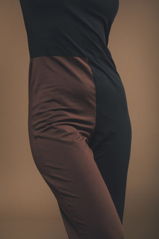 Image of black and brown jumpsuit made by Organique, a sustainable clothing brand.