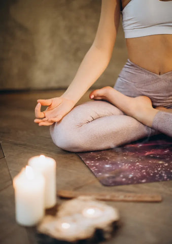 Women sitting in lotus pose.