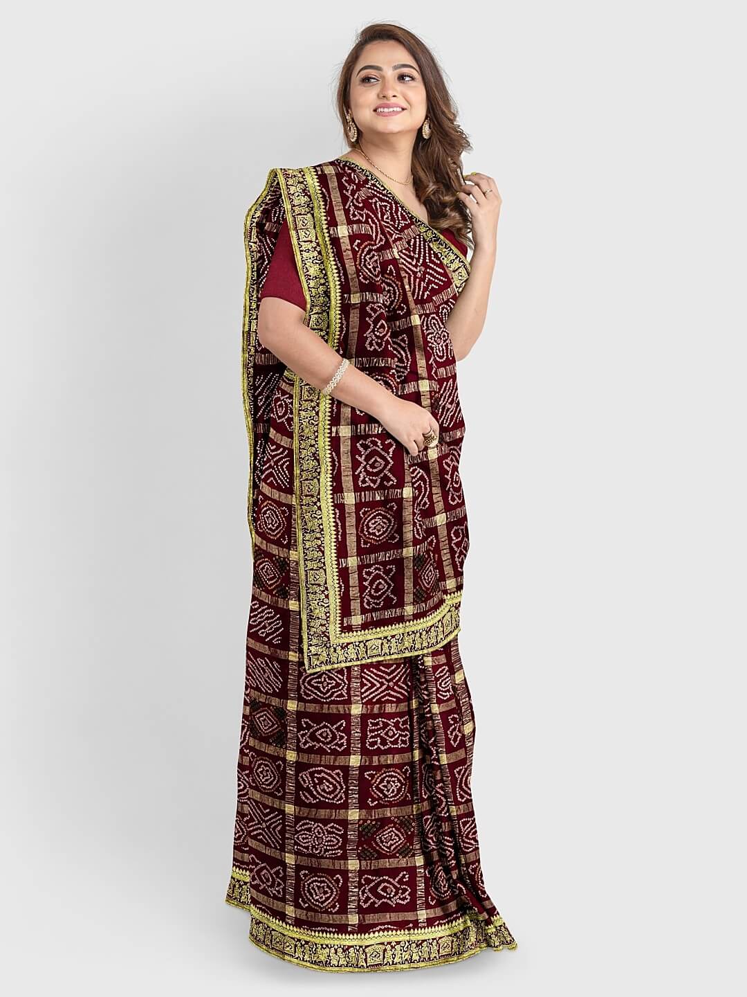 Traditional Gharchola saree. Pure zari checks & hand made small tie & dye  bandhej patterns. For more details call/wh… | Elegant saree, Bandhani  dress, Saree trends