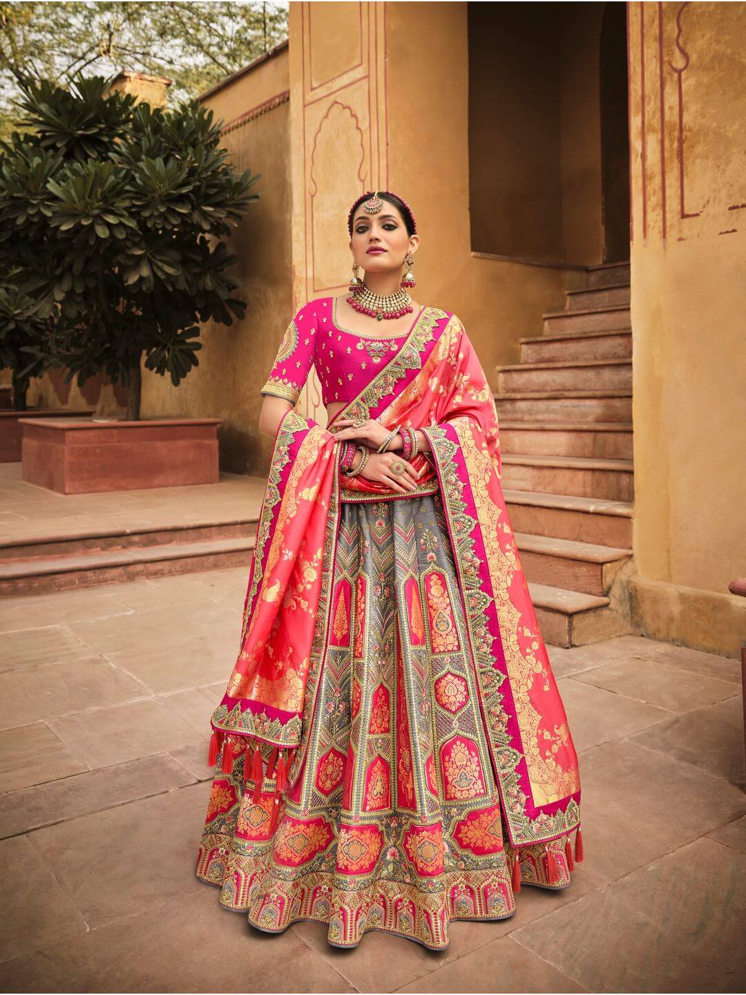 PETAL PINK LEHENGA SET WITH CONTRAST MULTI COLOURED EMBROIDERY PAIRED WITH  A MATCHING DUPATTA AND SILVER AND COLOURED EMBELLISHMENTS. - Seasons India