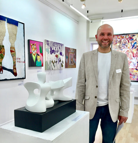 Gabriel Rivera standing next to his winning sculpture - Pixel Gallery