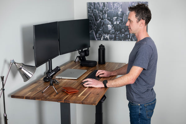 Man working at a standing desk