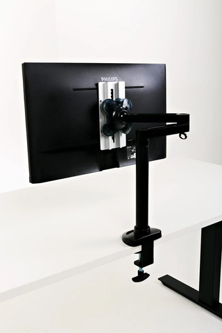 a standing desk for three monitors