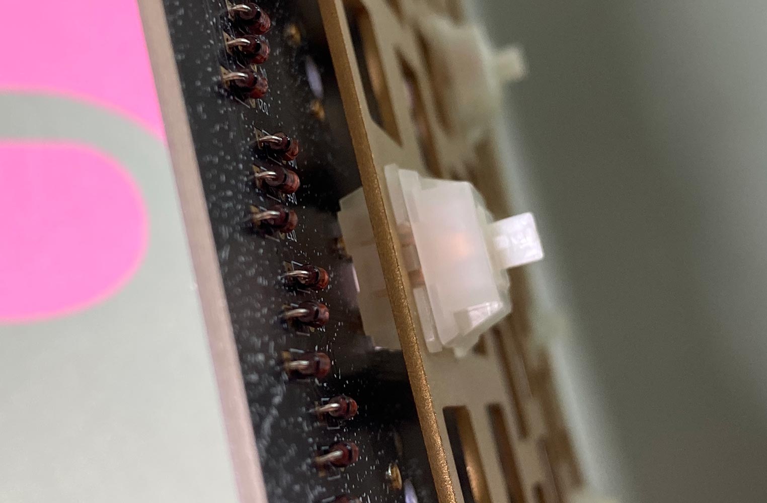 close up image of keyboard switch installed into plate and PCB