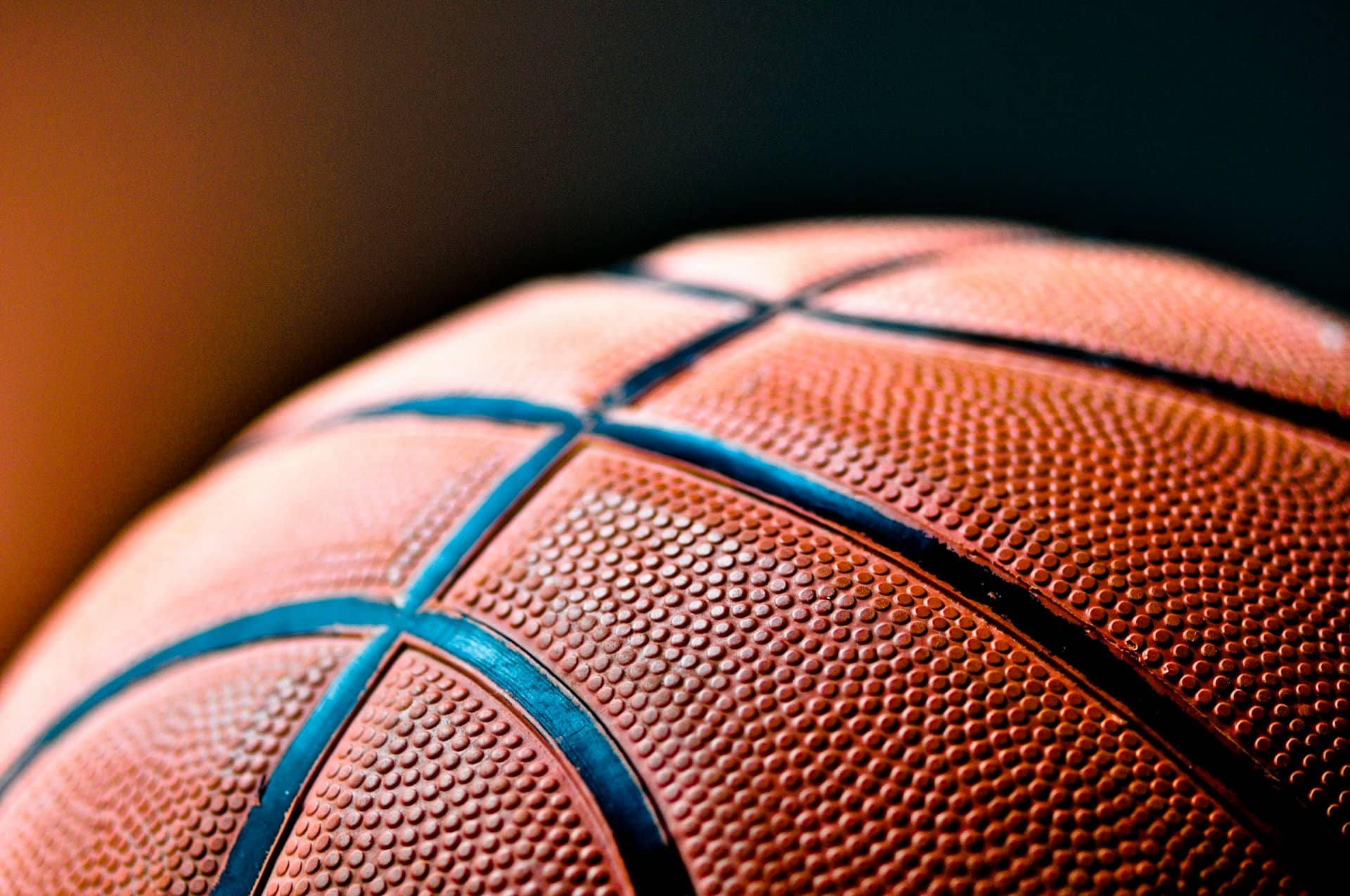 a closeup of a black and brown basketball