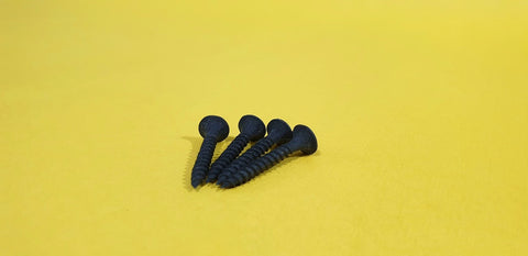 Black screws on a yellow background 