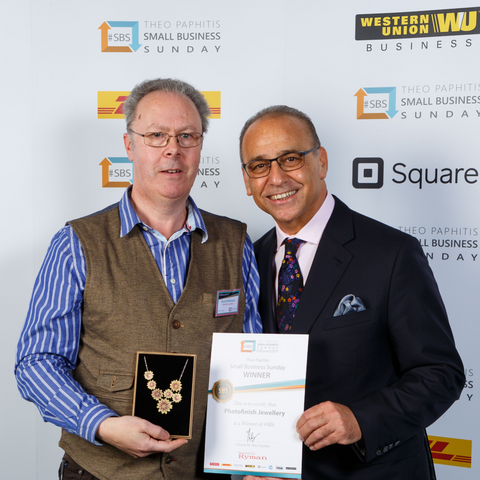 Theo Paphitis with award for Photofinish Jewellery