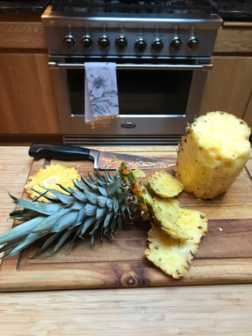 shun knife slicing pineapple
