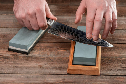 Sharpening a Shun knife on a whetstone 