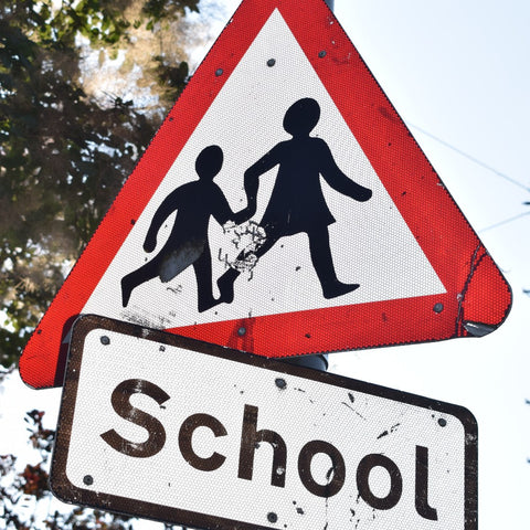 school children crossing sign