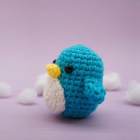 Woobles penguin made with blue acrylic yarn