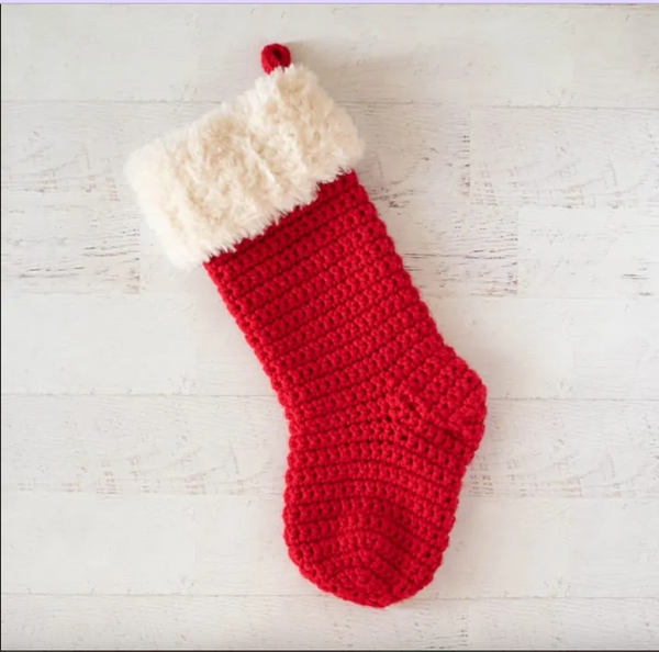 Red crochet Christmas stocking with white fluff