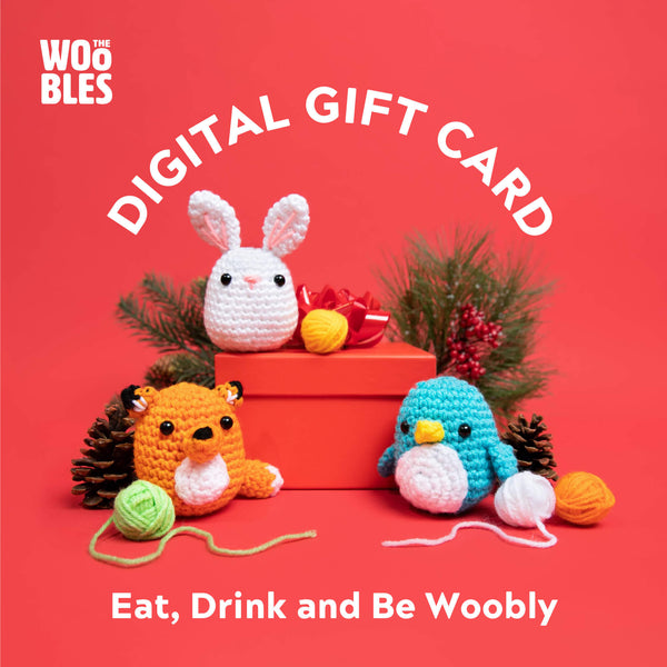 Gift card from The Woobles, featuring a brown fox crochet kit, a white bunny crochet kit and a blue penguin crochet kit with a white belly on the design