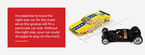 Slot cars next to ruler for measuring